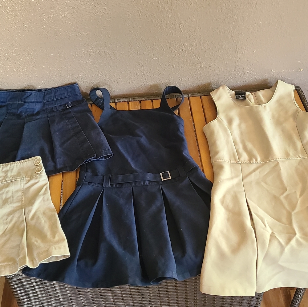 Girls jumper dresses and skorts.